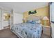 Bright bedroom with beach themed decor and a convenient ensuite bathroom at 9400 Shore Dr. # 722, Myrtle Beach, SC 29572