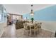 Comfortable dining area with seating for six and an open view into the living room at 9400 Shore Dr. # 722, Myrtle Beach, SC 29572