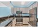 Kitchen with stainless steel appliances, granite countertops, and ample cabinet space at 9400 Shore Dr. # 722, Myrtle Beach, SC 29572
