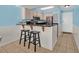 Kitchen with breakfast bar featuring barstool seating and stainless steel appliances at 9400 Shore Dr. # 722, Myrtle Beach, SC 29572