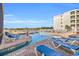 Relaxing outdoor pool area featuring brick pavers and comfortable lounge chairs at 9400 Shore Dr. # 722, Myrtle Beach, SC 29572