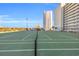 Well maintained tennis court ready for play with surrounding views of the area at 9400 Shore Dr. # 722, Myrtle Beach, SC 29572