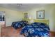 Sunny bedroom with two beds and decor and a ceiling fan with view to a balcony at 10200 Lake Shore Dr. # 16, Myrtle Beach, SC 29572