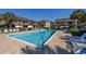 Large community pool offers a refreshing escape with ample seating and lush landscaping at 10200 Lake Shore Dr. # 16, Myrtle Beach, SC 29572