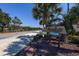 The community sign, Seagate Villas, is surrounded by palm trees and lush landscaping at 10200 Lake Shore Dr. # 16, Myrtle Beach, SC 29572