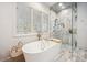 Bright bathroom with a marble floors, soaking tub, marble shower and gold fixtures at 1046 Wallace Pate Dr., Georgetown, SC 29440