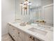 Bright bathroom with a marble counters, dual sinks, and modern gold fixtures at 1046 Wallace Pate Dr., Georgetown, SC 29440