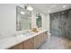 Modern bathroom features marble counters, dual sinks, a glass shower and light fixtures at 1046 Wallace Pate Dr., Georgetown, SC 29440
