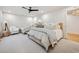 Spacious bedroom with two beds, chair and accent table, and neutral color pallete at 1046 Wallace Pate Dr., Georgetown, SC 29440