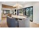 Bright dining room features a large table, modern chandelier, and scenic views at 1046 Wallace Pate Dr., Georgetown, SC 29440