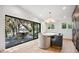 Dining area with deck access showcases natural light and tranquil outdoor views at 1046 Wallace Pate Dr., Georgetown, SC 29440