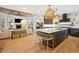 Expansive kitchen island with bar stools and contemporary light fixtures at 1046 Wallace Pate Dr., Georgetown, SC 29440