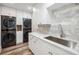 Well-equipped laundry room with new appliances, and marble backsplash at 1046 Wallace Pate Dr., Georgetown, SC 29440