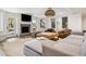 Cozy living room with brick fireplace, TV, sofa, and large windows at 1046 Wallace Pate Dr., Georgetown, SC 29440