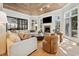 Beautiful living room featuring wood ceiling, fireplace, large windows, and comfortable seating arrangement at 1046 Wallace Pate Dr., Georgetown, SC 29440
