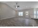 Spacious living room features recessed lighting, wood-look floors, and exterior access at 1107 Haden Place, Calabash, NC 28467