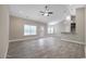 Open living room boasts wood-look floors, recessed lighting, and a ceiling fan at 1107 Haden Place, Calabash, NC 28467