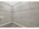 Spacious walk-in closet featuring white wire shelving for optimal storage and organization in the home at 1107 Haden Place, Calabash, NC 28467