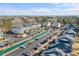 Community aerial view with a long water feature, parking, and multiple condo buildings at 1282 River Oaks Dr. # 9F, Myrtle Beach, SC 29579