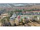Aerial shot of the condo community with a water feature, parking, and surrounding forest at 1282 River Oaks Dr. # 9F, Myrtle Beach, SC 29579