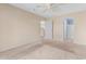 Neutral bedroom featuring carpet, ceiling fan, and adjoining bathroom for convenience at 1282 River Oaks Dr. # 9F, Myrtle Beach, SC 29579