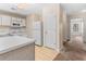 Bright kitchen with white cabinets, appliances, countertops, and wood flooring at 1282 River Oaks Dr. # 9F, Myrtle Beach, SC 29579
