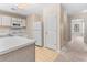 Bright kitchen with white cabinets, appliances, countertops, and wood flooring at 1282 River Oaks Dr. # 9F, Myrtle Beach, SC 29579