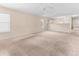 Spacious living room features neutral paint, plush carpet, and natural light at 1282 River Oaks Dr. # 9F, Myrtle Beach, SC 29579