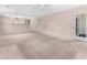 Spacious living room features neutral paint, plush carpet, and natural light at 1282 River Oaks Dr. # 9F, Myrtle Beach, SC 29579