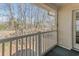 Patio with railing overlooking lush trees providing a peaceful outdoor experience at 1282 River Oaks Dr. # 9F, Myrtle Beach, SC 29579
