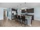 Beautiful kitchen with stainless steel appliances, granite countertops, and dark brown cabinetry at 1320 Midtown Village Dr., Conway, SC 29526