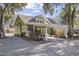 Backyard featuring a partially covered patio and lush greenery with Spanish moss hanging from the trees at 136 Da Gullah Way # A, Pawleys Island, SC 29585