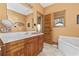 Bathroom featuring a single sink vanity and a large soaking tub at 136 Da Gullah Way # A, Pawleys Island, SC 29585