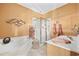 Bathroom with a soaking tub, glass shower, and double vanity at 136 Da Gullah Way # A, Pawleys Island, SC 29585