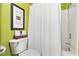 Bathroom featuring white toilet and shower/tub combo with a white shower curtain at 136 Da Gullah Way # A, Pawleys Island, SC 29585