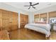 Bright bedroom with hardwood floors, two closets, and a ceiling fan at 136 Da Gullah Way # A, Pawleys Island, SC 29585