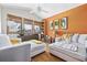 Living room with vaulted ceiling, hardwood floors, and windows with natural light at 136 Da Gullah Way # A, Pawleys Island, SC 29585