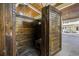 This outdoor shower features wood paneling and a door for privacy at 136 Da Gullah Way # A, Pawleys Island, SC 29585
