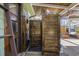 This outdoor shower features wood paneling, ceiling fan and door for privacy at 136 Da Gullah Way # A, Pawleys Island, SC 29585