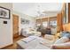 Bright sitting room with vaulted ceiling, hardwood floors, and windows with natural light at 136 Da Gullah Way # A, Pawleys Island, SC 29585