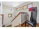 Stairway featuring hardwood steps, a wood railing, and decorative wall art at 136 Da Gullah Way # A, Pawleys Island, SC 29585