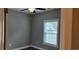 Clean bedroom featuring a window with blinds at 1407 Gooseneck Place # 202, Murrells Inlet, SC 29576