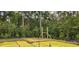 New construction home foundation with yellow barrier on a wooded lot at 1407 Gooseneck Place # 202, Murrells Inlet, SC 29576