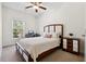 This bedroom features a bed, window, dresser, and desk with computer and printer at 1487 Lanterns Rest Rd. # 4, Myrtle Beach, SC 29579