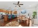 Open-concept dining area features wood floors, modern light fixture, and seamless flow into the kitchen at 1487 Lanterns Rest Rd. # 4, Myrtle Beach, SC 29579
