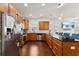 Bright kitchen with stainless steel appliances, wood cabinets, granite counters, and a breakfast bar at 1487 Lanterns Rest Rd. # 4, Myrtle Beach, SC 29579