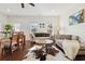 Inviting living area featuring hardwood floors, comfortable seating, and ample natural light with dining area at 1487 Lanterns Rest Rd. # 4, Myrtle Beach, SC 29579