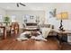 Bright and airy living room with hardwood floors, stylish furnishings, and natural light streaming through the windows at 1487 Lanterns Rest Rd. # 4, Myrtle Beach, SC 29579