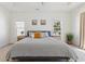 Cozy main bedroom showcasing a tray ceiling, fan, and soothing decor, creating a relaxing atmosphere at 1487 Lanterns Rest Rd. # 4, Myrtle Beach, SC 29579
