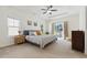 Spacious main bedroom with tray ceiling, fan, and ensuite bathroom, offering relaxation and comfort at 1487 Lanterns Rest Rd. # 4, Myrtle Beach, SC 29579